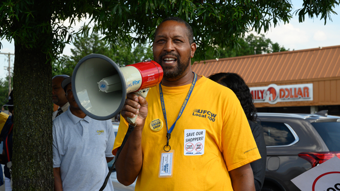 Kevin Freeman speaks at Shoppers action